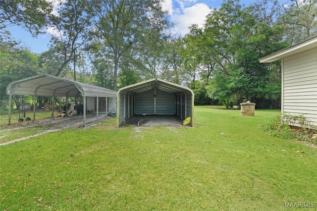 view of yard with driveway and a carport