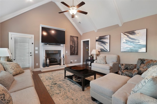 living room with ceiling fan, beam ceiling, high vaulted ceiling, hardwood / wood-style flooring, and a fireplace