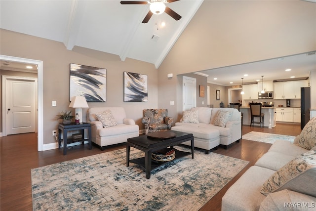 living room featuring beamed ceiling, ceiling fan, dark wood-type flooring, and high vaulted ceiling