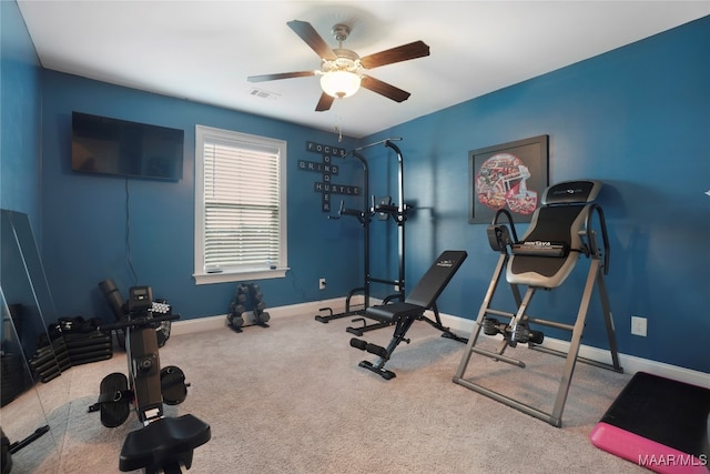 workout area with ceiling fan and carpet flooring