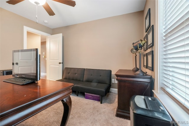 home office with ceiling fan and light colored carpet