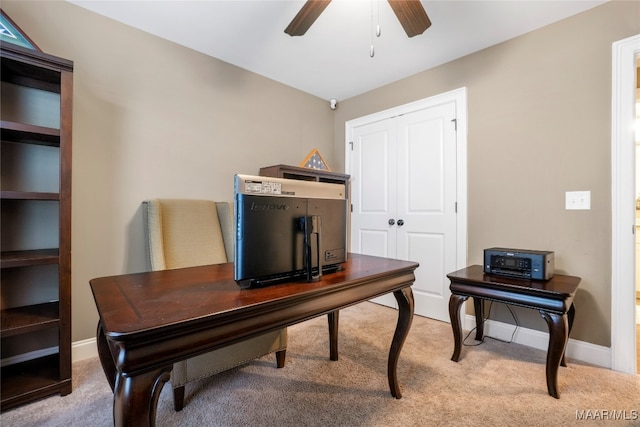 carpeted office with ceiling fan