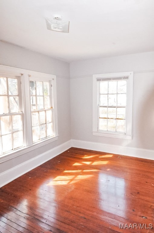 empty room featuring hardwood / wood-style floors