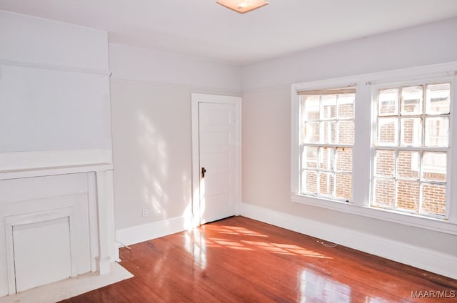 empty room with hardwood / wood-style floors