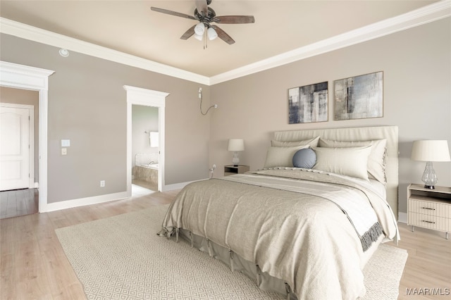 bedroom featuring light wood-type flooring, crown molding, ceiling fan, and ensuite bathroom