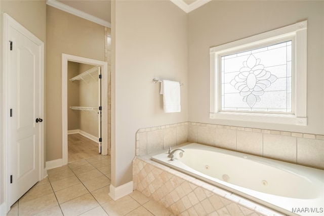 bathroom featuring crown molding, tile patterned flooring, and tiled bath