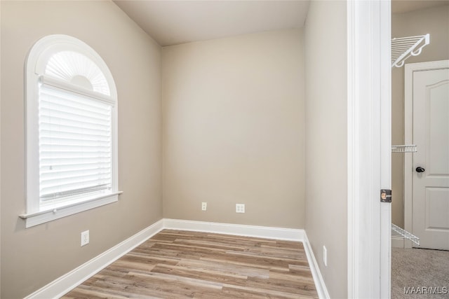 empty room with light hardwood / wood-style floors