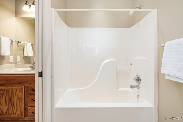 bathroom with shower / tub combination and vanity