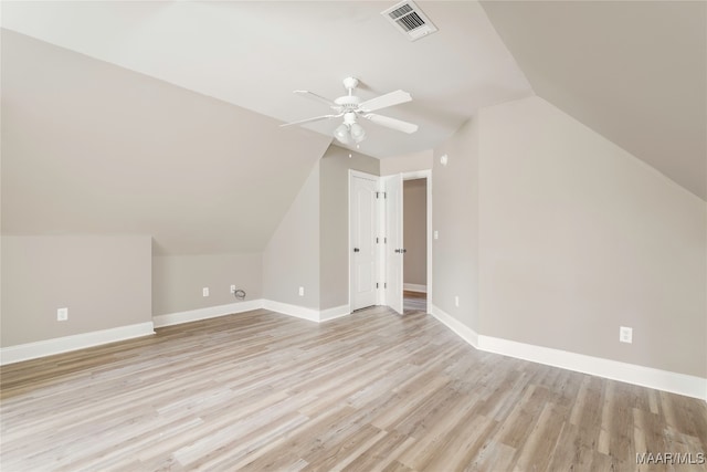 additional living space featuring light hardwood / wood-style floors, lofted ceiling, and ceiling fan