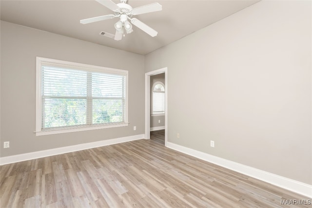 empty room featuring light wood-type flooring and ceiling fan