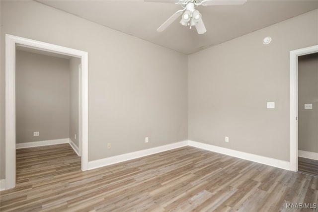 spare room featuring light hardwood / wood-style floors and ceiling fan