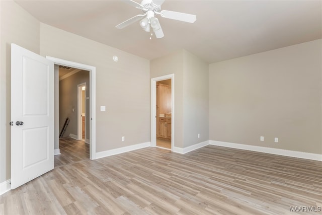 unfurnished bedroom with light hardwood / wood-style floors, ensuite bathroom, and ceiling fan