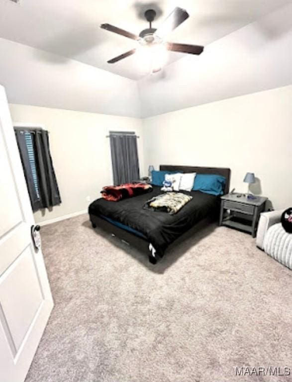 bedroom featuring carpet, vaulted ceiling, ceiling fan, and baseboards