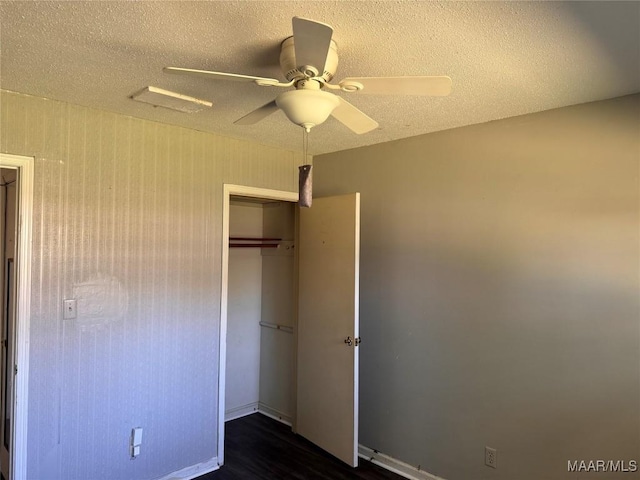 unfurnished bedroom featuring ceiling fan, a closet, and a textured ceiling