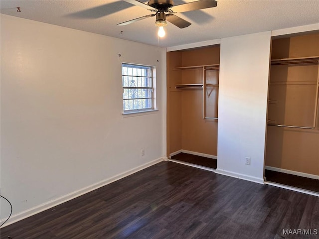 unfurnished bedroom featuring a textured ceiling, dark hardwood / wood-style floors, and ceiling fan