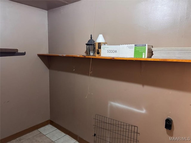 laundry area featuring light tile patterned flooring