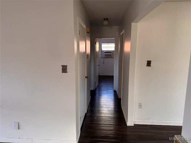 hall featuring cooling unit and dark hardwood / wood-style flooring