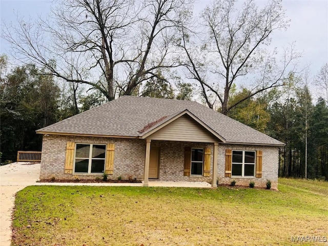 551 Butter And Egg Rd, Troy, AL 36081 - view of front of property featuring brick siding, a shingled roof, and a front yard