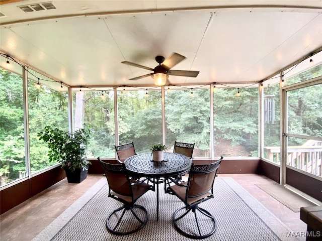 sunroom featuring plenty of natural light and ceiling fan