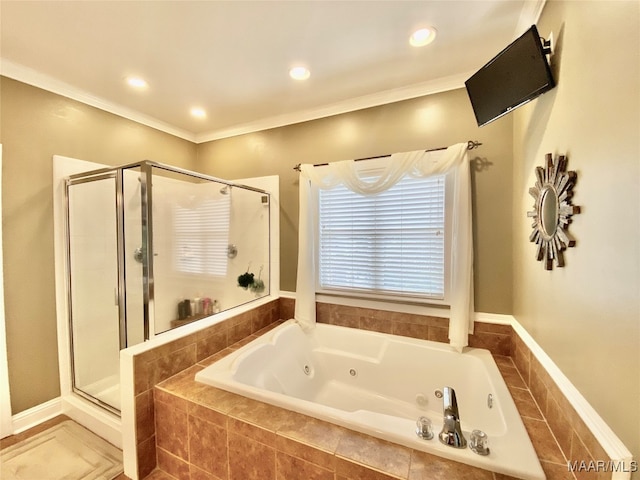 bathroom featuring ornamental molding and independent shower and bath