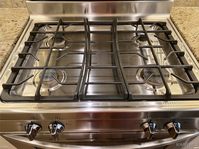 details with light stone counters and stainless steel range oven