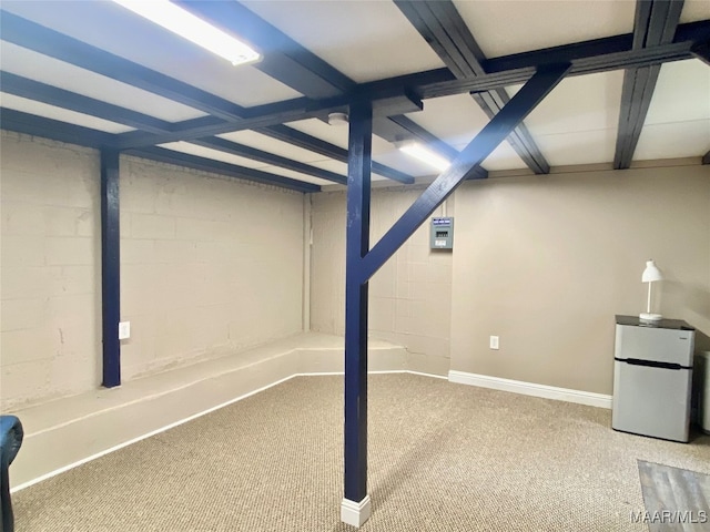 basement featuring carpet and white fridge