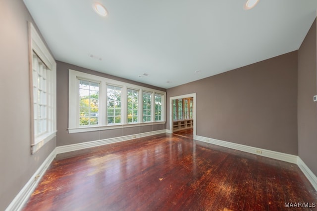 unfurnished room featuring hardwood / wood-style flooring