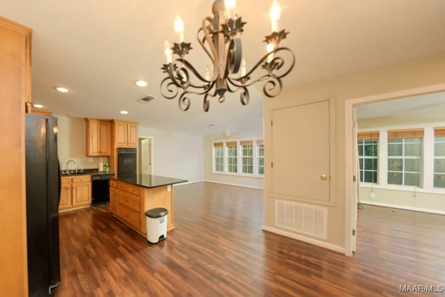 1311 Woodward Ave, Montgomery, AL 36106 - kitchen featuring black appliances, dark countertops, dark wood-style floors, open floor plan, and recessed lighting