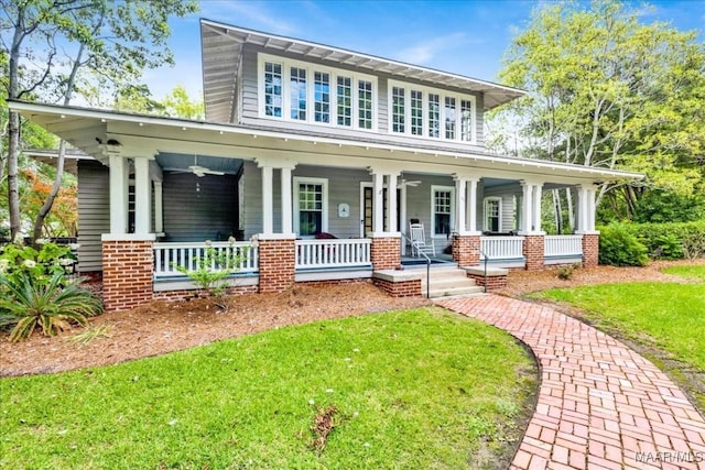1311 Woodward Ave, Montgomery, AL 36106 - view of front of house with covered porch and a front yard