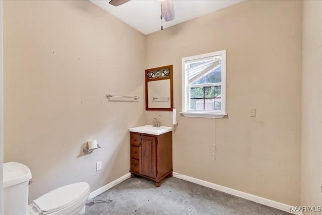 1311 Woodward Ave, Montgomery, AL 36106 - half bath featuring ceiling fan, toilet, baseboards, vanity, and unfinished concrete floors