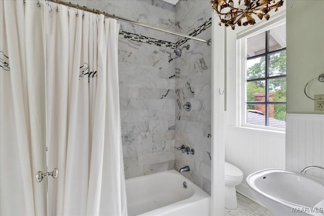 1311 Woodward Ave, Montgomery, AL 36106 - full bath with a wainscoted wall, shower / bathtub combination with curtain, and toilet