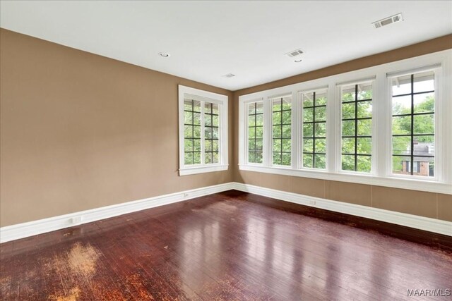 1311 Woodward Ave, Montgomery, AL 36106 - empty room with baseboards and dark wood-type flooring