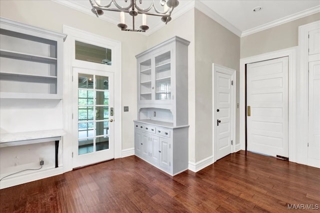 1311 Woodward Ave, Montgomery, AL 36106 - entryway with ornamental molding, a chandelier, dark wood finished floors, and baseboards