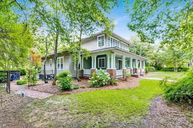 1311 Woodward Ave, Montgomery, AL 36106 - view of property exterior featuring a porch and a lawn