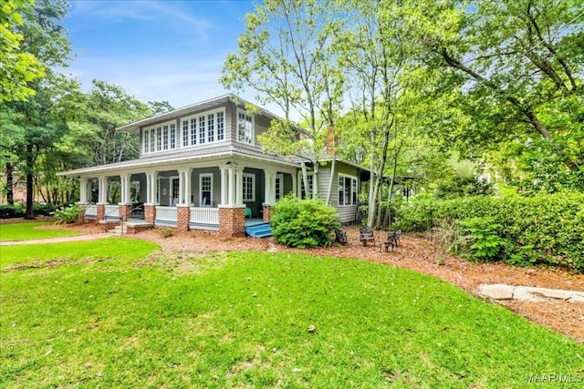 1311 Woodward Ave, Montgomery, AL 36106 - back of house featuring covered porch and a lawn
