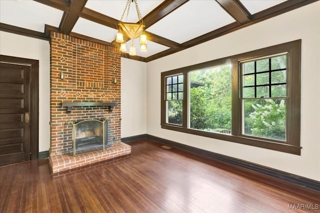 1311 Woodward Ave, Montgomery, AL 36106 - unfurnished living room featuring coffered ceiling, wood-type flooring, baseboards, a fireplace, and beam ceiling