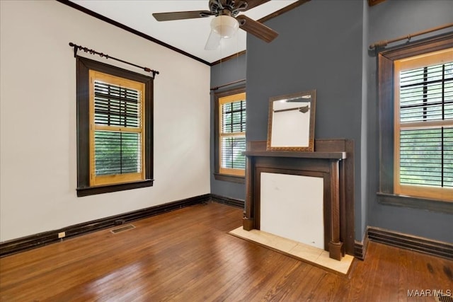 1311 Woodward Ave, Montgomery, AL 36106 - unfurnished room with wood finished floors, ceiling fan, baseboards, and crown molding