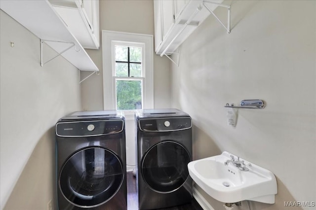 1311 Woodward Ave, Montgomery, AL 36106 - laundry area featuring cabinet space and independent washer and dryer