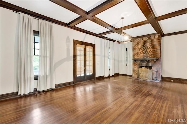 1311 Woodward Ave, Montgomery, AL 36106 - unfurnished living room with french doors, coffered ceiling, wood finished floors, a fireplace, and a chandelier