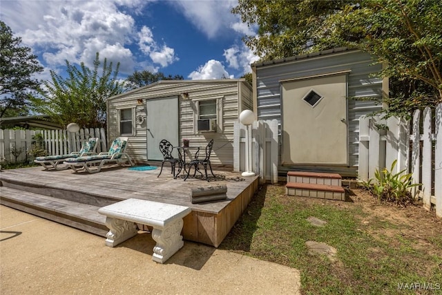 wooden terrace featuring cooling unit