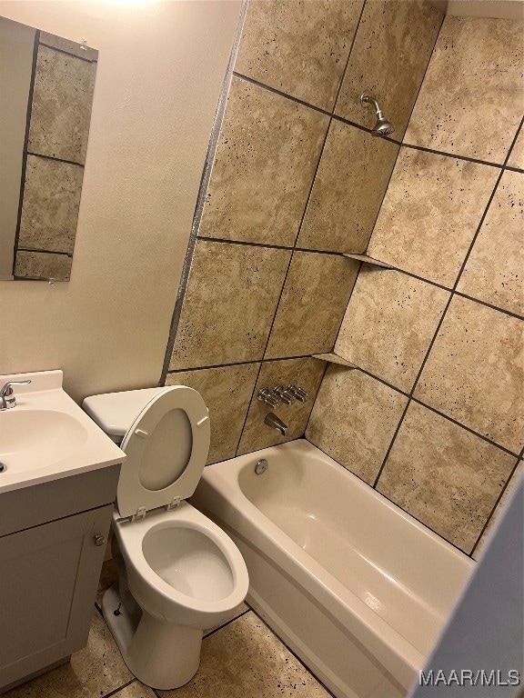 full bathroom with vanity, toilet, and tiled shower / bath