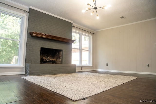 unfurnished living room with a fireplace, crown molding, and dark wood-type flooring