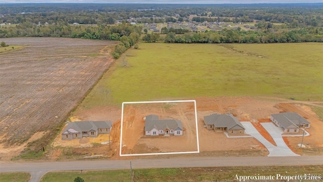 birds eye view of property with a rural view