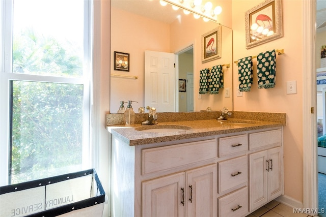 bathroom with tile patterned floors and vanity