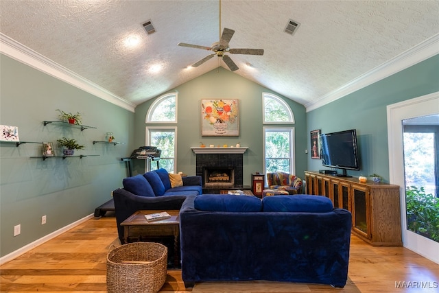 living room with wood-type flooring and a textured ceiling