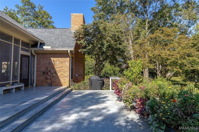 wooden deck with a patio