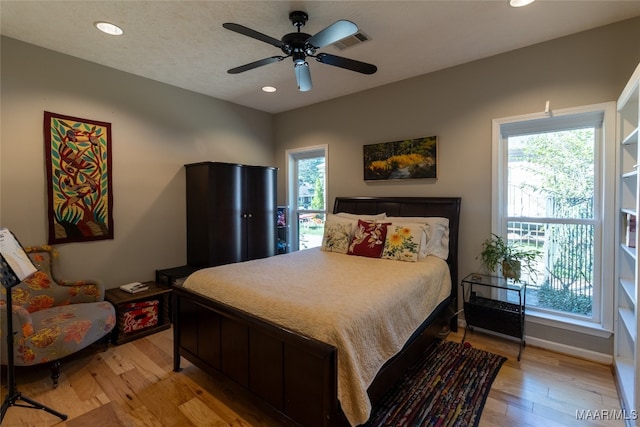 bedroom featuring ceiling fan and light hardwood / wood-style flooring