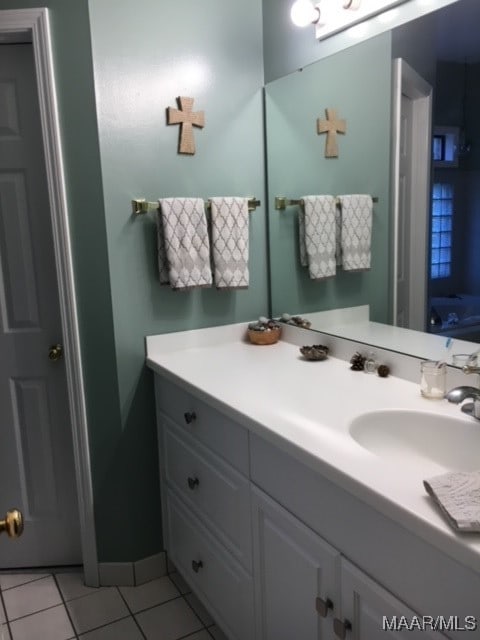 bathroom with tile patterned flooring and vanity