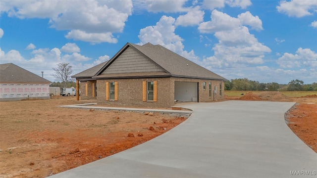 view of side of home featuring a garage