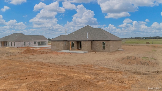 back of house with a patio